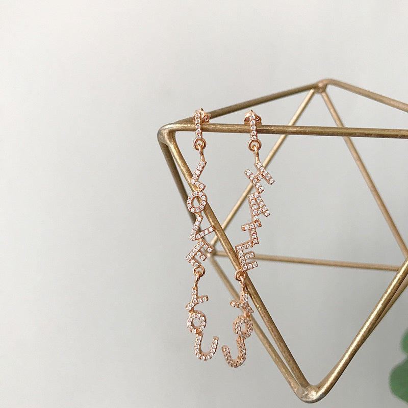 I Love You I Hate You Letter Drop Earrings In Champagne Gold